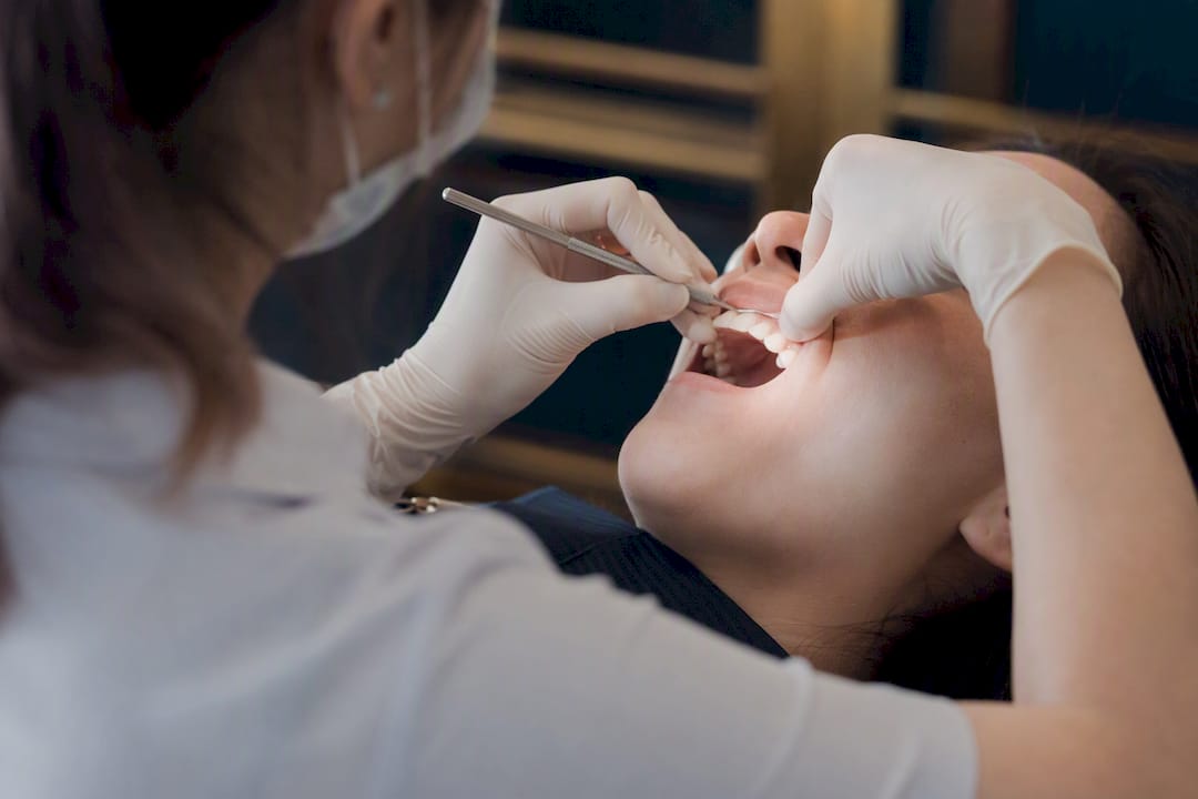 Dentist probing gums for recession